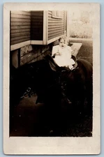 c1910's Toddler Dressed White Riding Horse House Backyard RPPC Photo Postcard