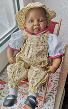 Heidi Ott Puppe, Größe 33 cm, im Liegestuhl mit rotem Bezug