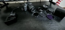 Canon EOS 2000D 24.1MP Digital SLR Camera w/ 18-55mm Lens, and flash.