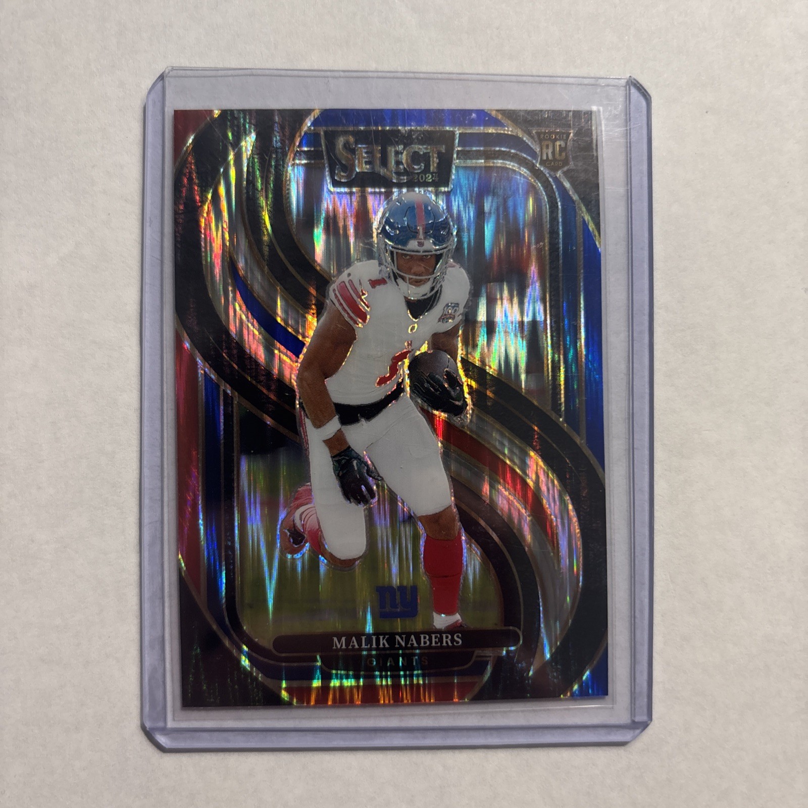 Malik Nabers 2024 Panini Select #116 Red and Blue Prizm Shock Premier RC