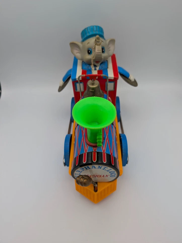 Juguetes modernos de colección litografía de hojalata y plástico elefante loco músico tren motor Foto 2 de 4