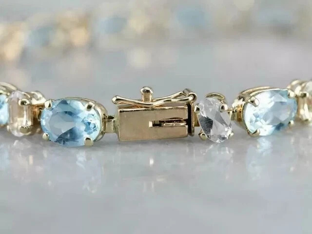 12-Piece Oval Lab-Created Aquamarine Tennis Bracelet for Women in 14K Gold Plate 7 Inch  