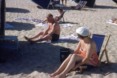 1950s Red Border Kodachrome 35mm Slide Women and Man on Sandy Beach Suntanning