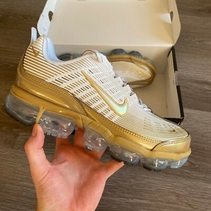 gold nike trainers