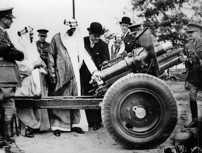 Prince Emir Saud of Saudia Arabia views new artillery English case- Old Photo