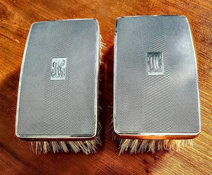 Pair of English Sterling Silver Military Brushes, Birmingham, 1936