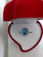 Oval Blue Topaz Halo Ring with Accents