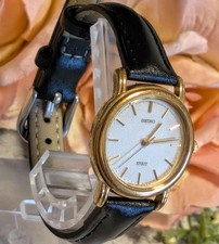 Working Seiko Spirits ladies' watch, gold case, new strap.