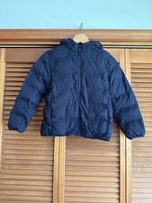 Uniqlo kids puffer jacket is sized for children aged 7-8 Navy Blue