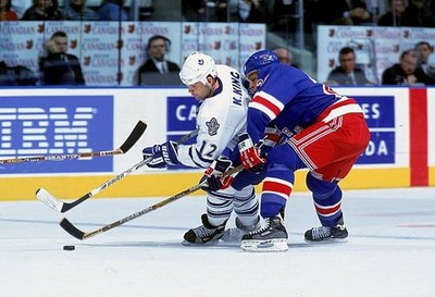 Kris King Toronto Maple Leafs fights for control puck at a game v - Old Photo