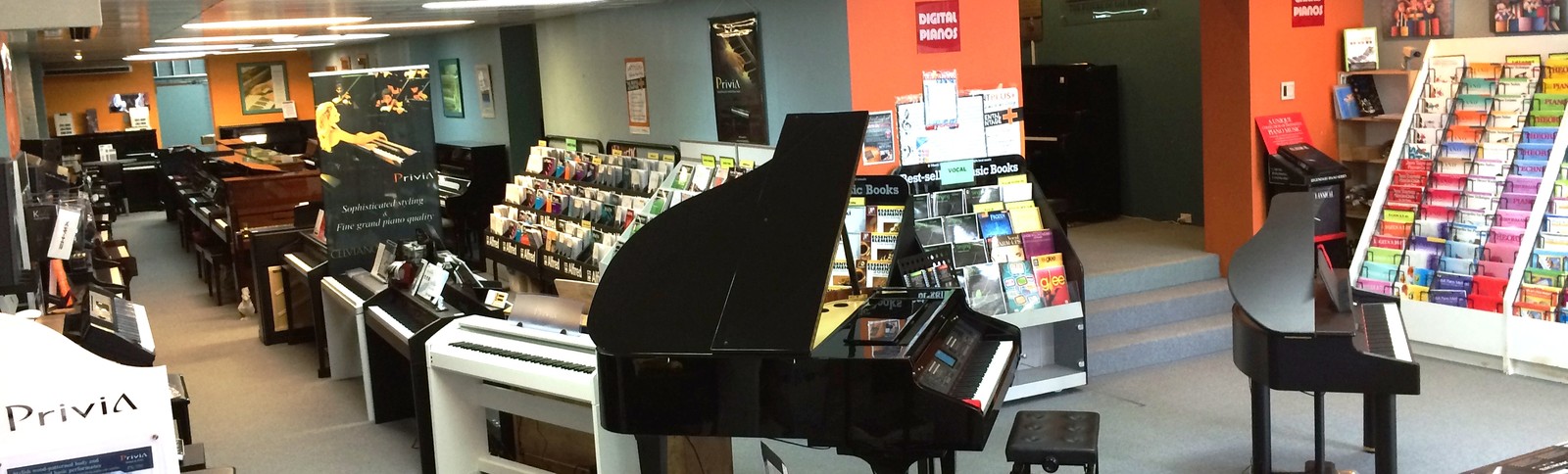 Carlingford Music Centre piano showroom with acoustic and digital pianos on display