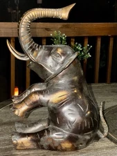 VINTAGE 11.75” TALL AND HEAVY BRASS SEATED TRUNK UP ELEPHANT DARK BRONZE PATINA