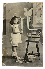 Real Photo Postcard of Female Child Hanging Wash, Brown Hair, Blue Tint, washtub