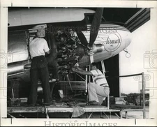 Press Photo Mechanics work on Air News Inc. Plane - sax30942