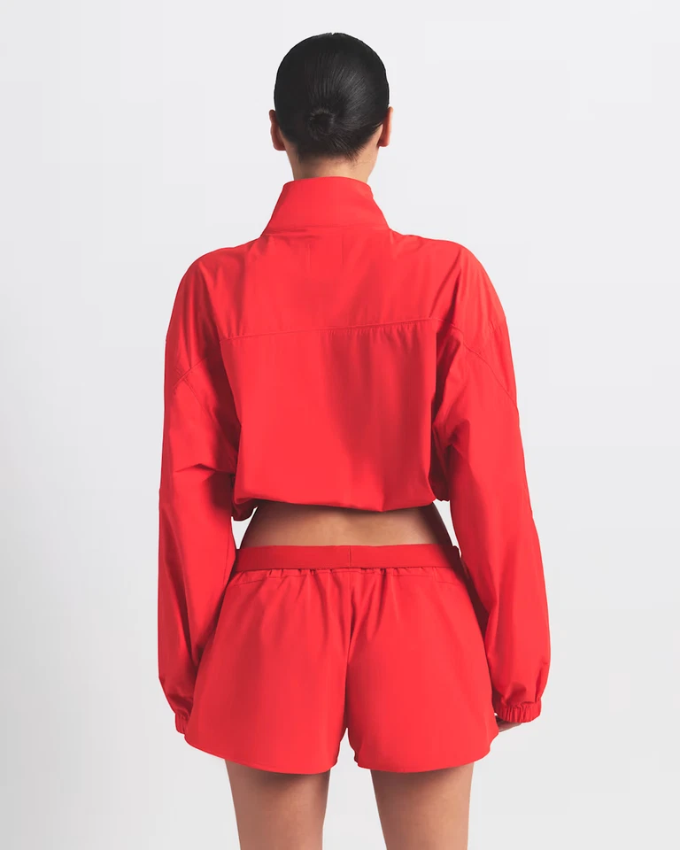 CHAQUETA CORTA NikeSKIMS Nike x SKIMS Tejido Nylon Edición Limitada Rubí S Preventa Foto 2 de 4