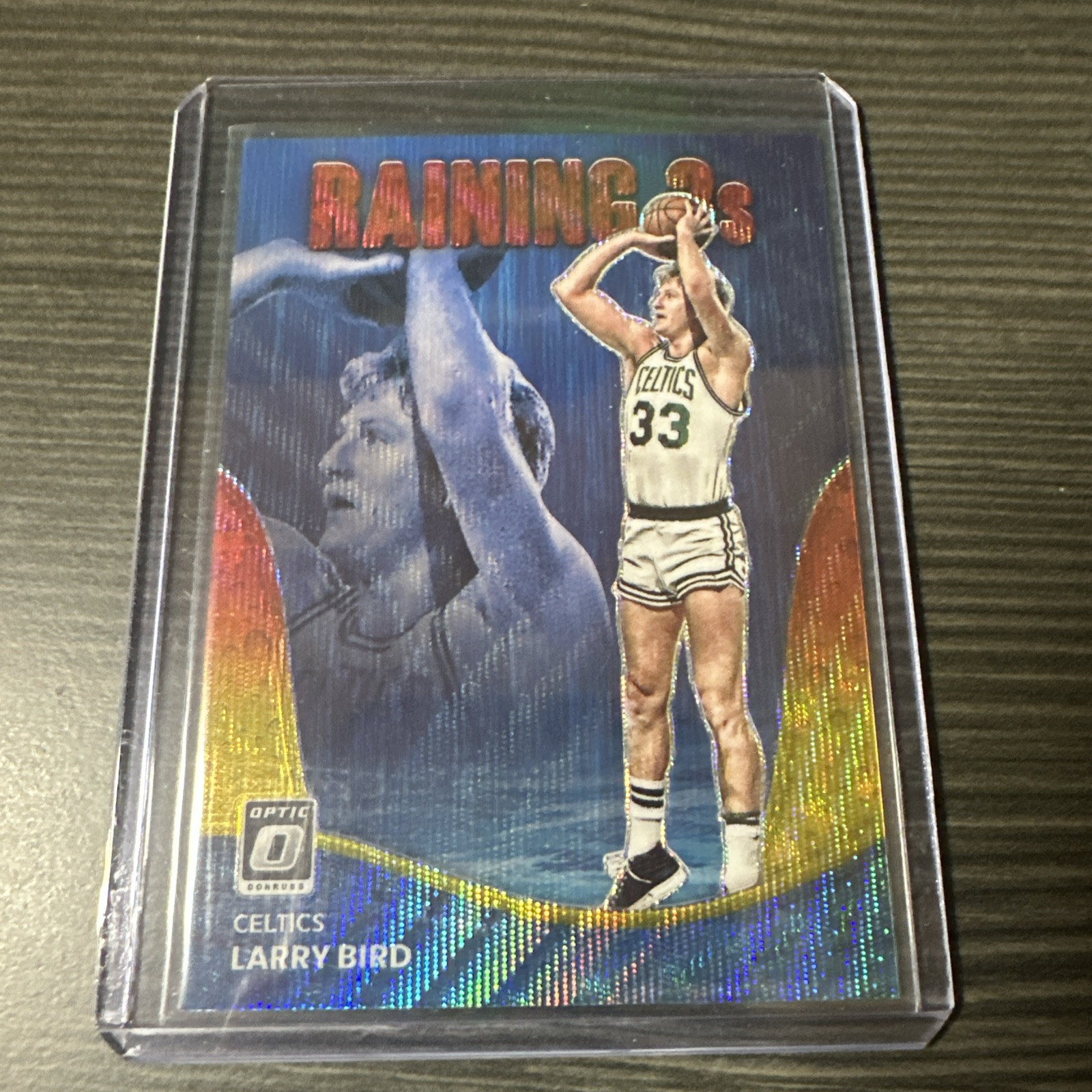 2022-23 Donruss Optic Raining 3s Red and Gold Wave Larry Bird 89/99