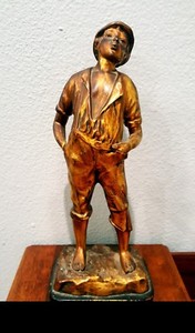 whistling boy figurine