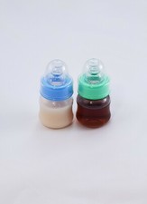 Two Sealed 2oz Reborn Baby Formula Apple Juice Bottles w/ NO HOLE NIPPLES