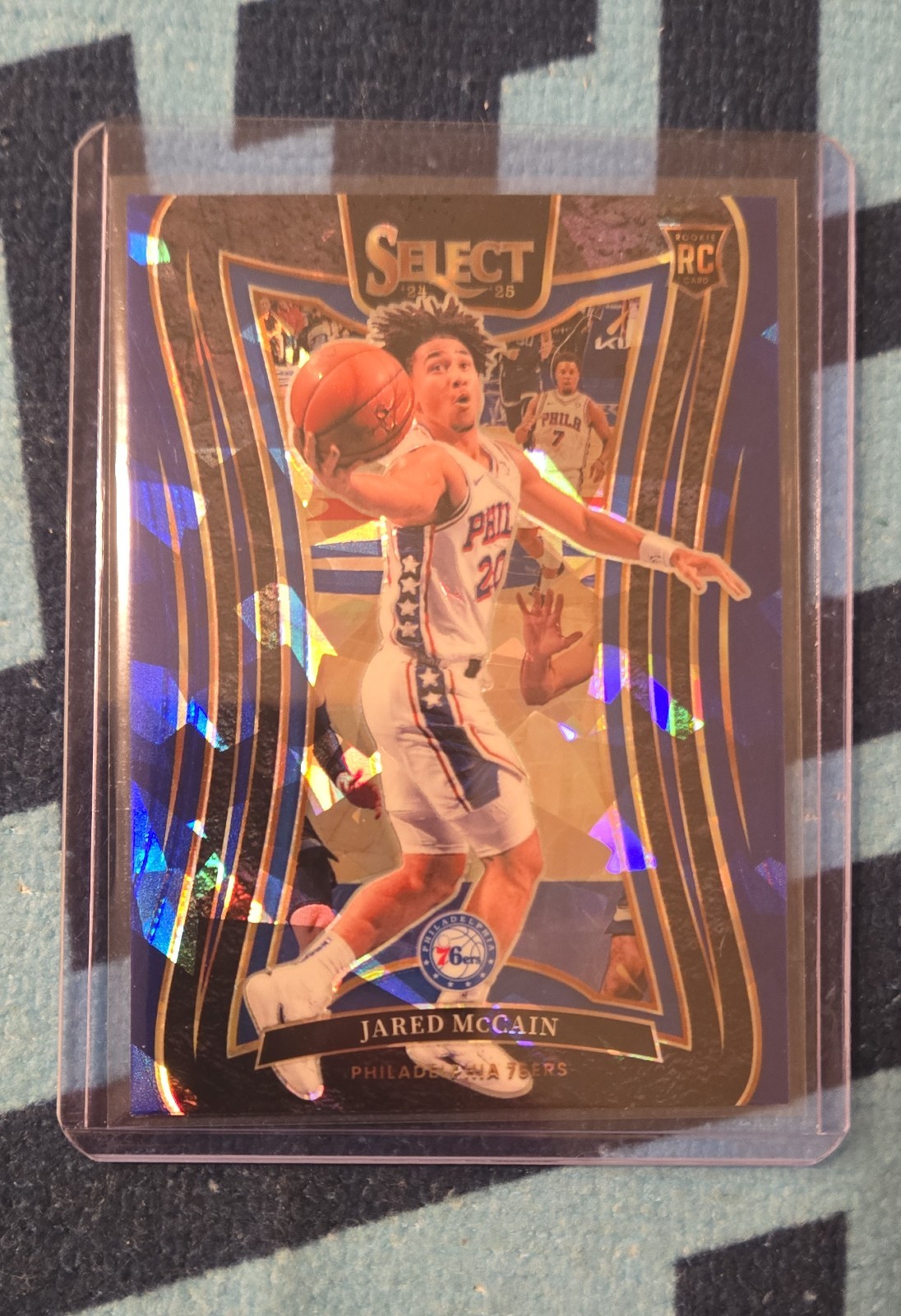 2024-25 Panini Select - Mezzanine Jared McCain #393 Blue Cracked Ice Prizm (RC)