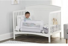 The Regalo Swing Down Convertible Crib Rail Guard. 33 Inch By 16 Inch.