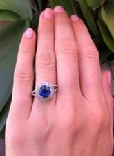 Showcasing A Round Blue Natural Round 2.20CT Sapphire With Double Halo CZ Ring