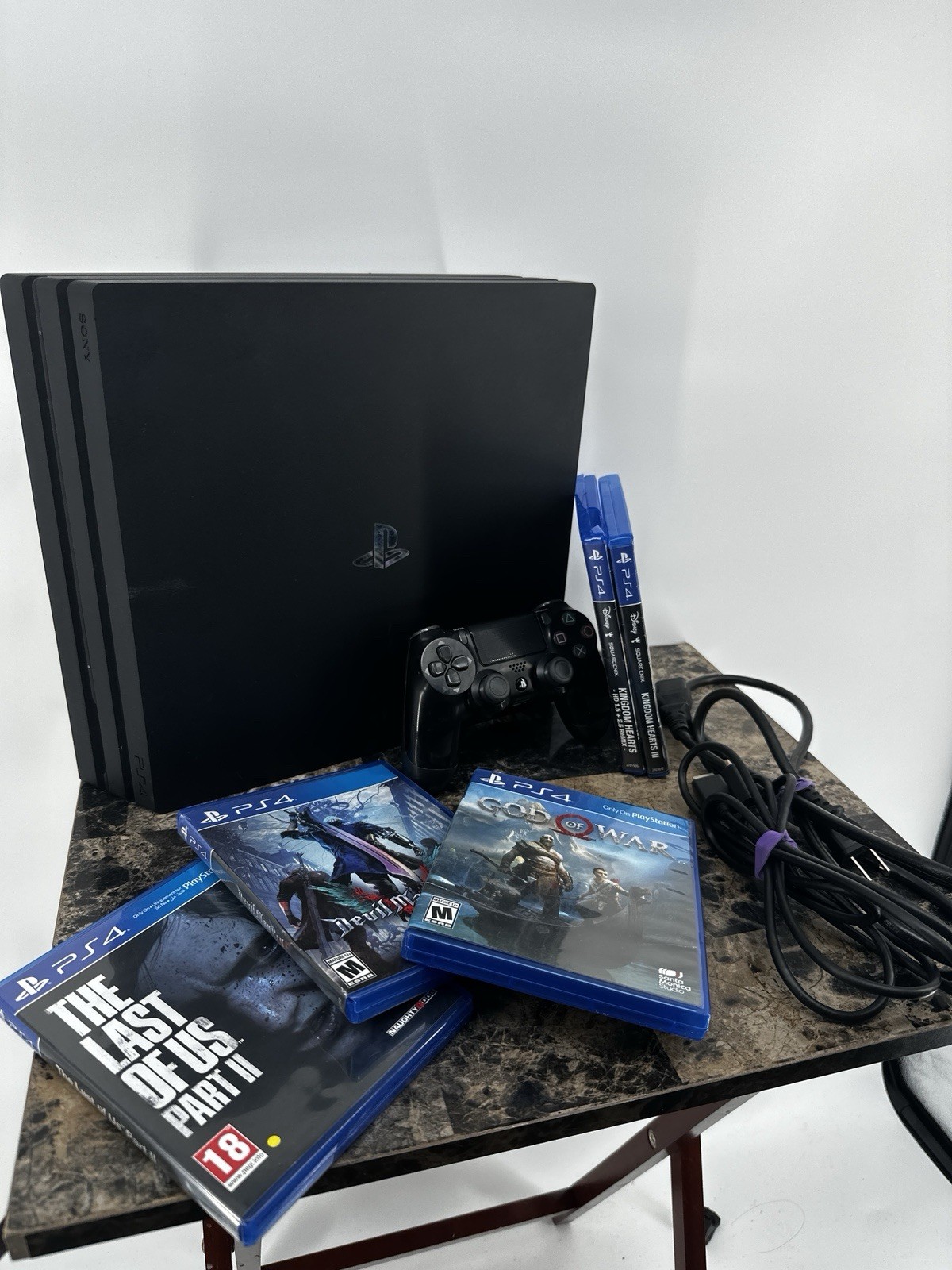 PS4 Pro 1TB Bundle w/ Controller + 5 Games (God of War, TLOU II, KH ...