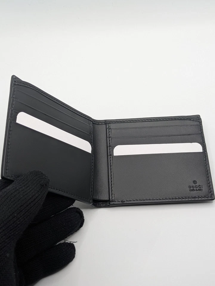 Cartera de cuero liso con logotipo dorado Gucci negra G2U sin etiquetas Foto 3 de 4