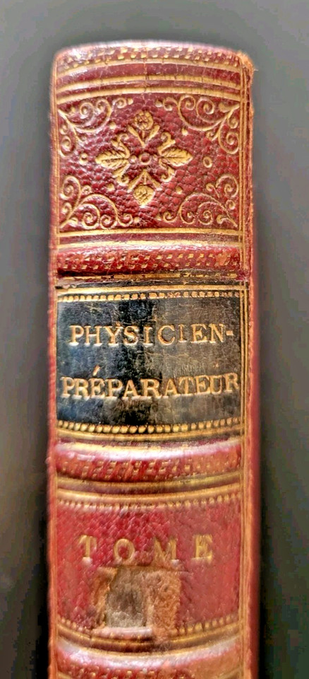 An 1853 leather-bound French physics book with illustrated scientific instrument engravings — a genuinely beautiful antiquarian tome that doubles as shelf art.