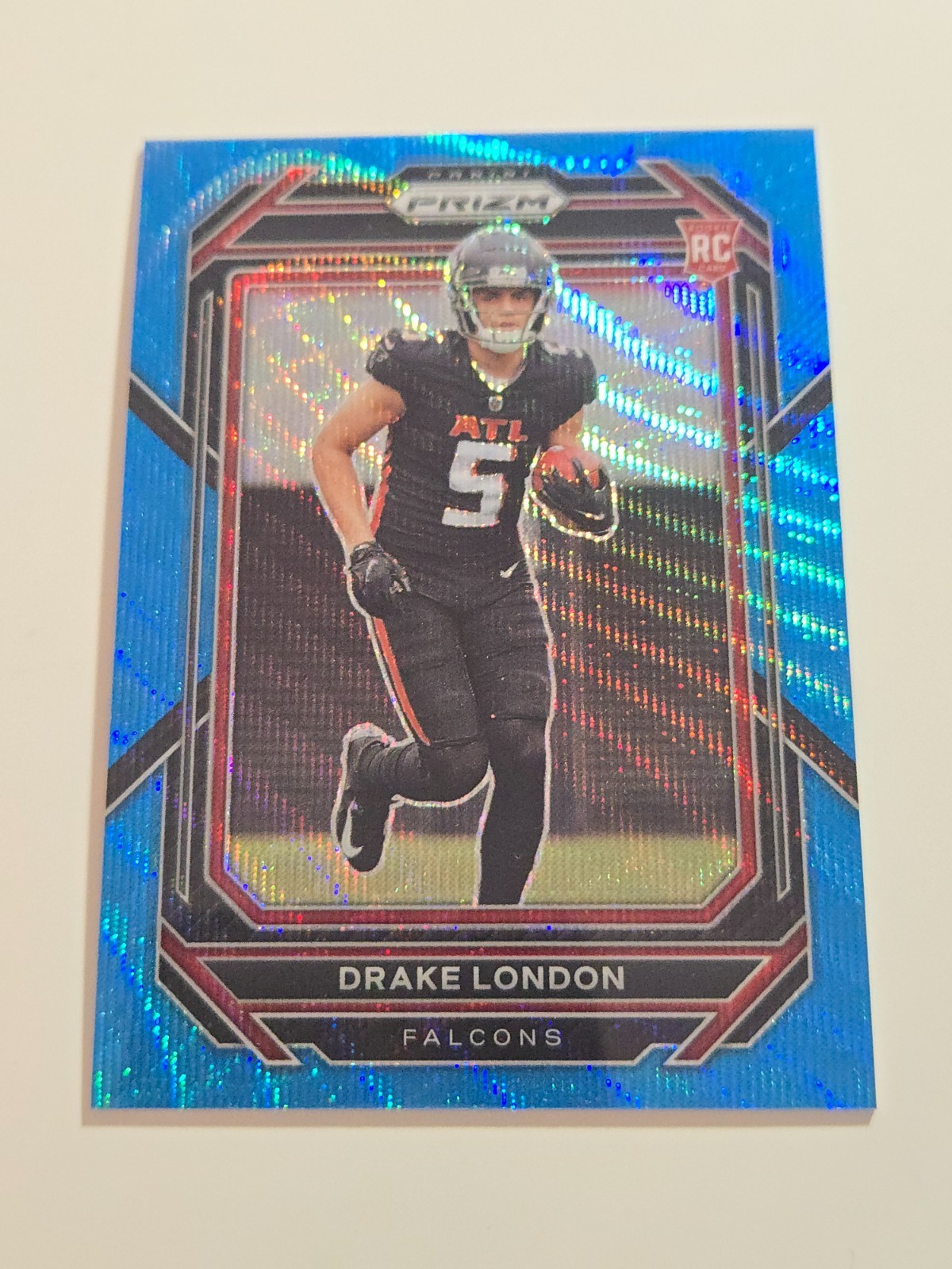 2022 Panini Prizm - Rookies Drake London #308 Blue Wave Prizm #186/199 (RC)