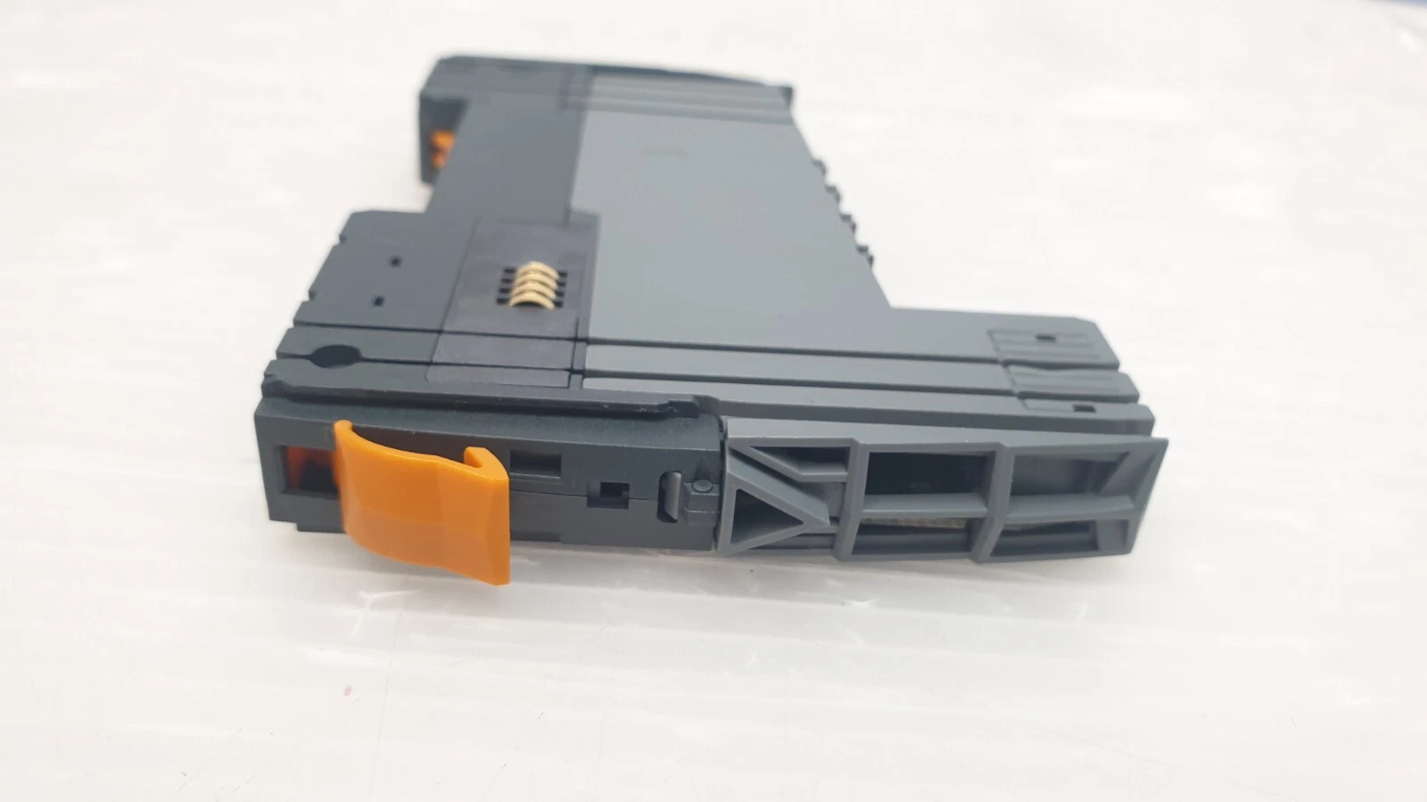 End of the X20 module with orange locking lever and bus contacts