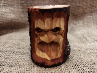 Wooden face. Wood carving. Handcrafted.