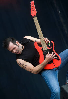 Ken Susi of American metalcore band Unearth playing his signature  - Old Photo