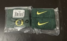 NUEVO CON ETIQUETAS 2 paquetes de pulseras Nike Oregon Ducks secuoya/amarillo talla única banda para el sudor R10