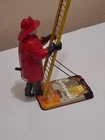 Louis Marx & Co. Smokey Joe climbing firefighter - vintage wind up tin toy