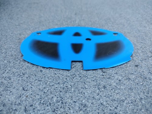 Toyota Hybrid. Used OEM grille emblem backing plate insert. - Picture 2 of 3