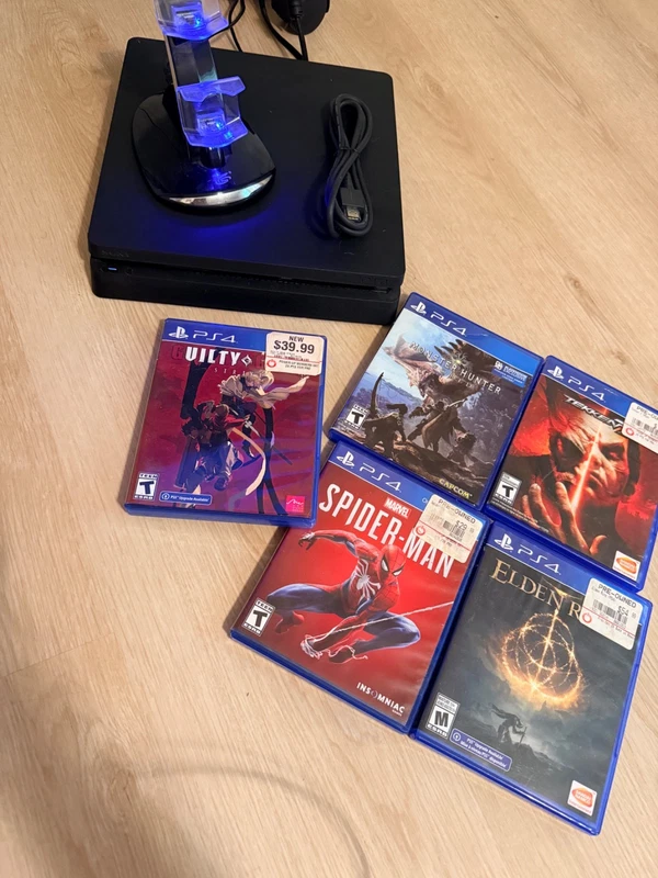 Sony PlayStation 4 bundle with five games and a charging stand