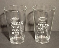 Omaha Steaks Beer Glasses (2) "Steak Night Done Right." & "Steak Your Claim." 