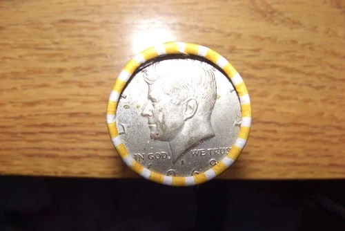 Kennedy half dollar roll with a 40% silver 1968-d half on end in vV- good cond.