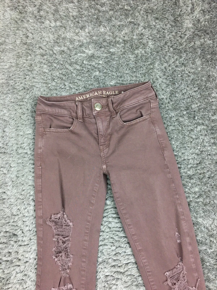 Pantalones de mezclilla American Eagle Jegging para mujer talla 0 rosa/marrón súper elásticos desgastados Foto 2 de 4