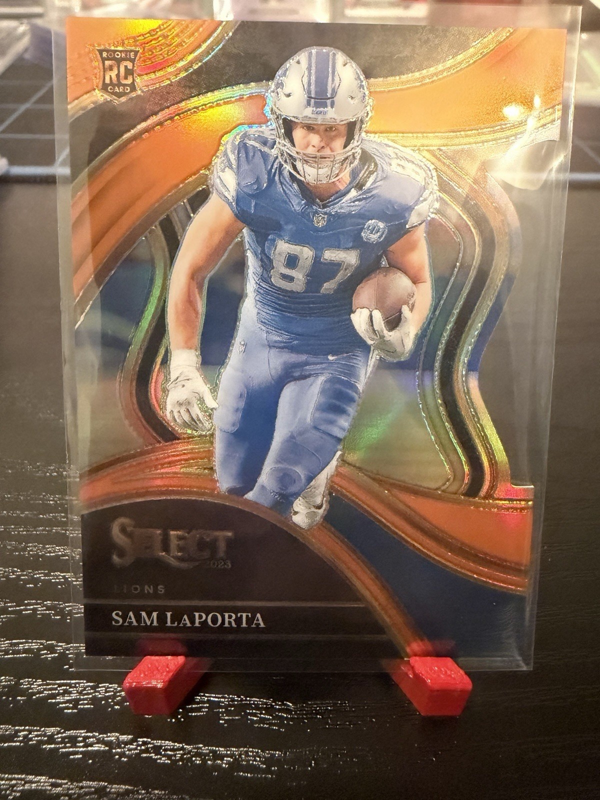 2023 Panini Select - Club Level Sam LaPorta #221 Orange Prizm Die-Cut /399 (RC)