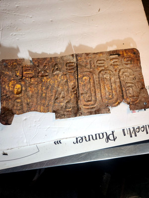 1935 License Plate Original Rusted and damaged. Stored in garage 20+ yrs vintage