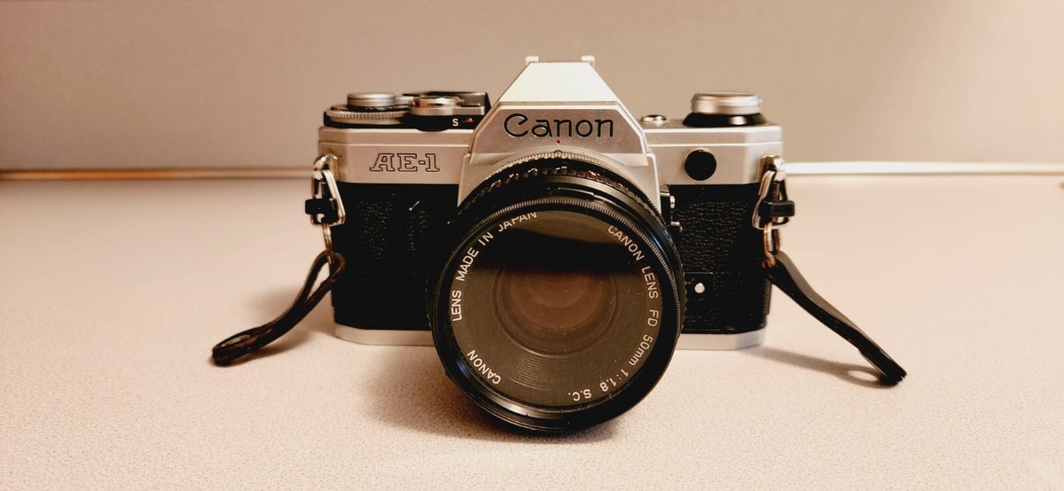 Canon AE-1 Film Camera, w/50mm f/1.4 Canon Lens & FD 135mm 1 : 3.5 Lens & Case.