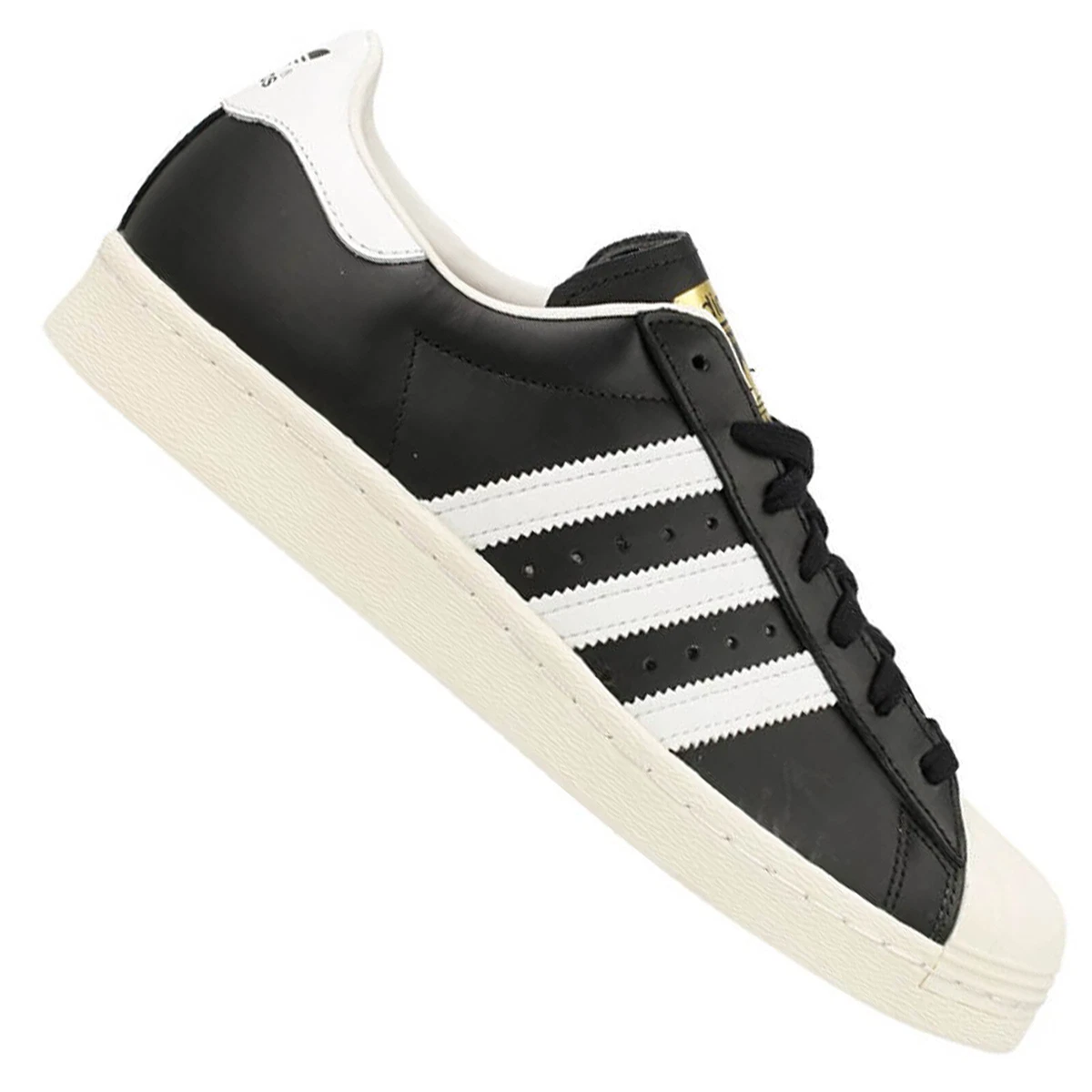 Superstar blanche top noir et dore