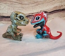 Set Of 2 Fingerlings Wowwee Red, Blue, And White And A Doom T Rex.