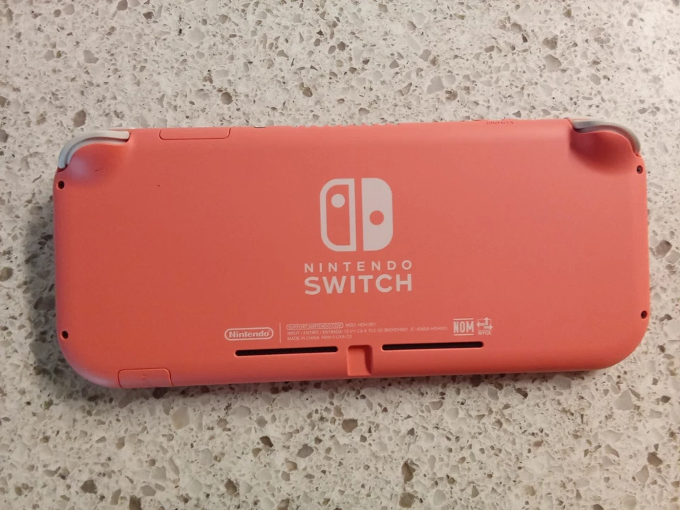 Nintendo Switch Lite Coral Paquete con 7 Juegos y Estuche Foto 3 de 3