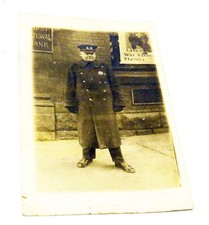 WWI ERA REAL PHOTO POSTCARD – BANK GUARD / POLICEMAN OUTSIDE FIRST NATIONAL BANK