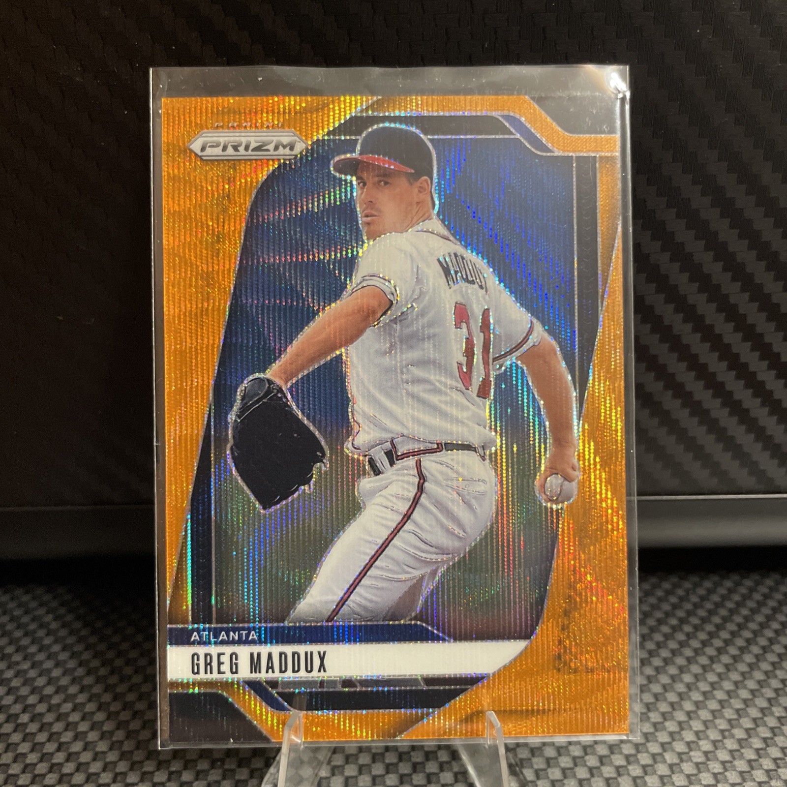 2025 Panini Prizm - Greg Maddux, Greg Maddux #67 Orange Wave Prizm /49