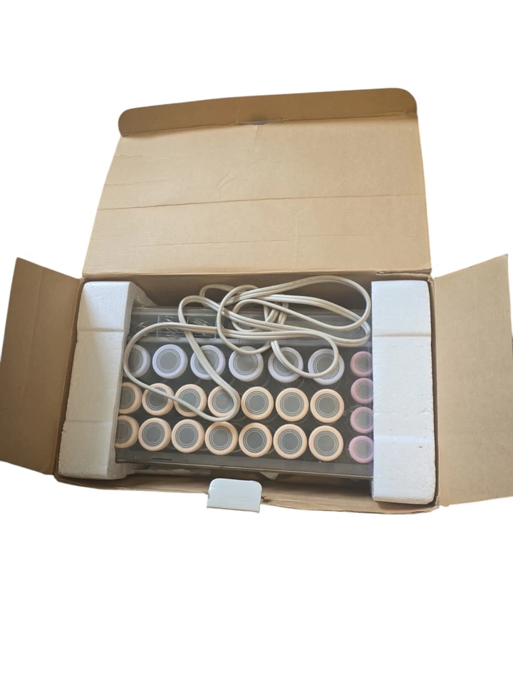 Setter eléctrico vintage Phillips Norelco 24 rodillos flocados 1986 con caja Foto 4 de 4