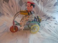 Mechanical Wind Up Tin Toy Man on Tricycle Reproduction