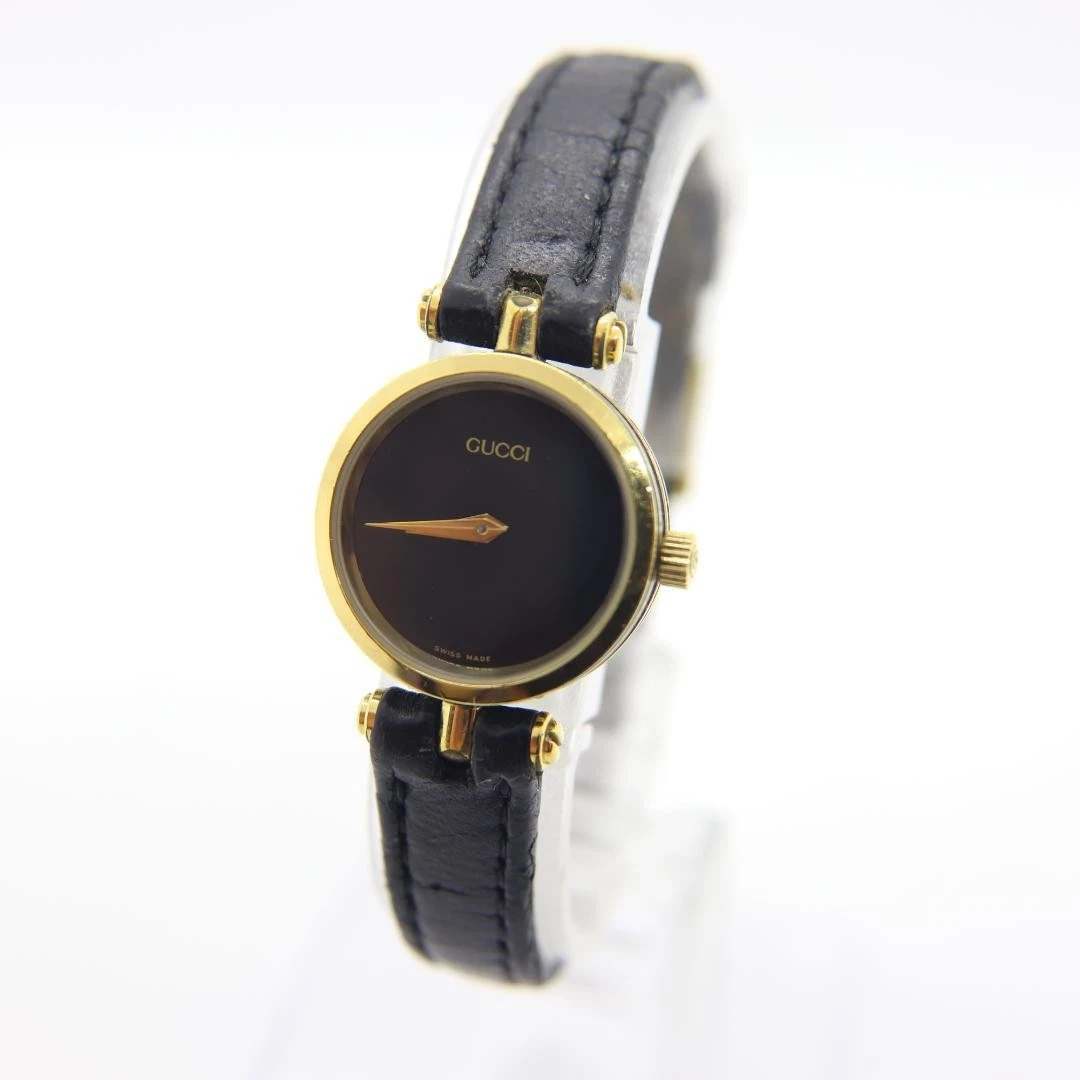 Montre Gucci ligne noire 21 mm quartz ronde vintage noir or femme